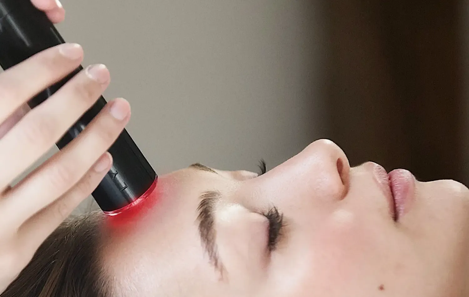 LYMA Laser Penny close up red Facial Massager