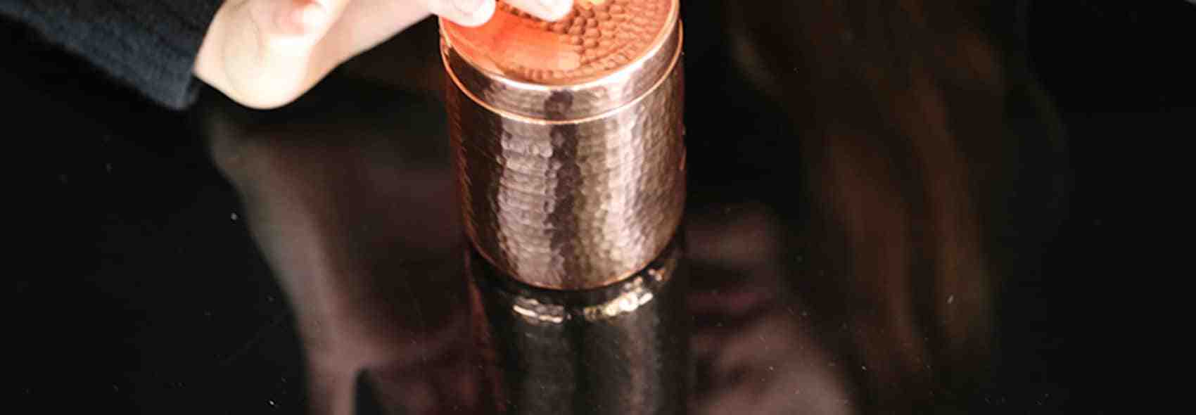 LYMA tablets in copper jar BLACK BACKGROUND