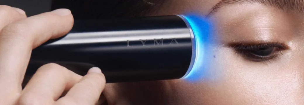 Woman uses the laser on face skin
