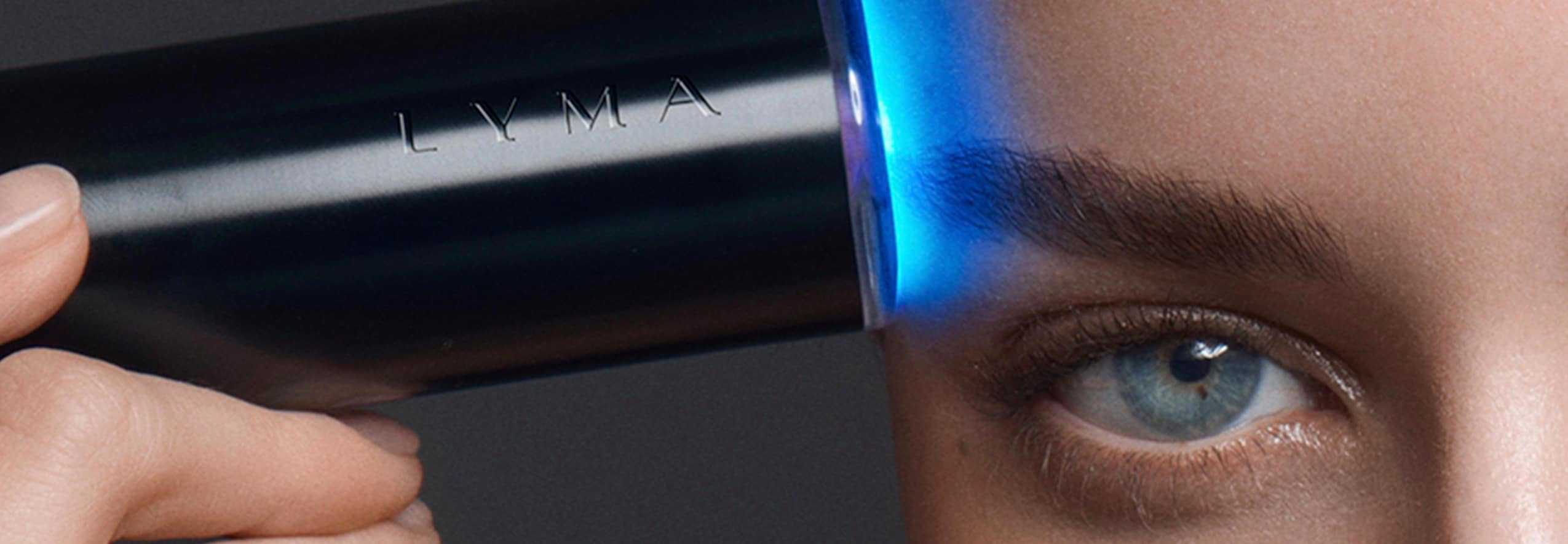Lady holds laser above the eye area