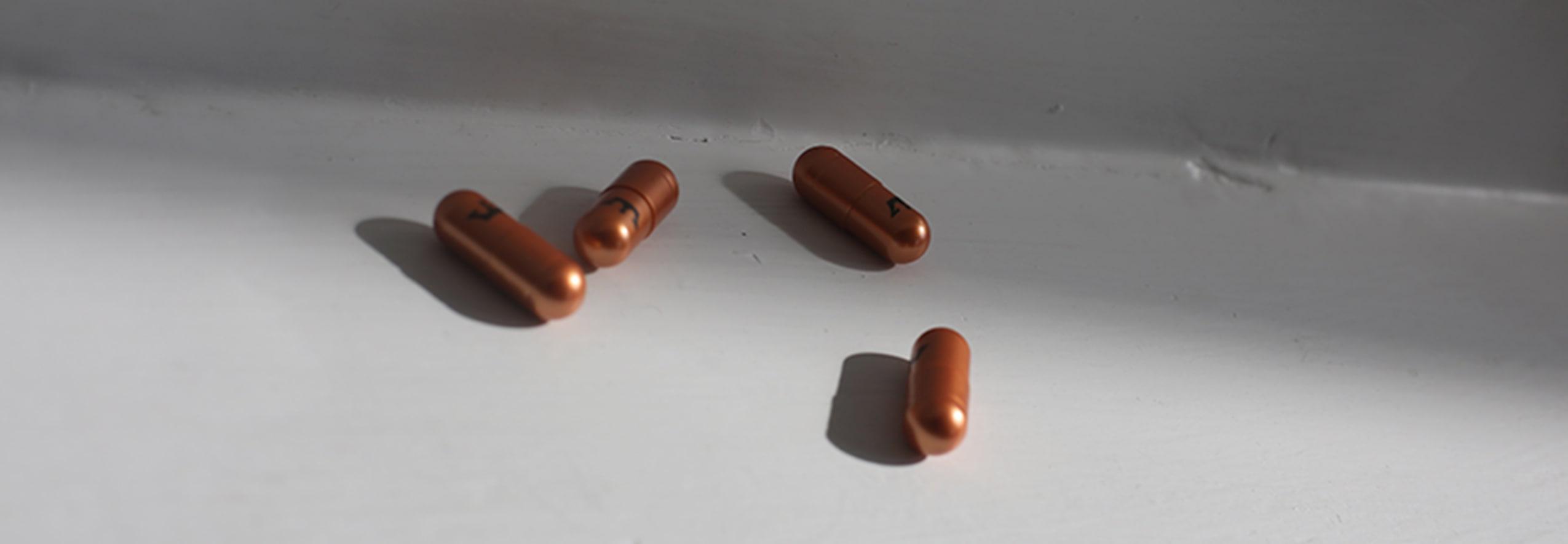 Pills on white table