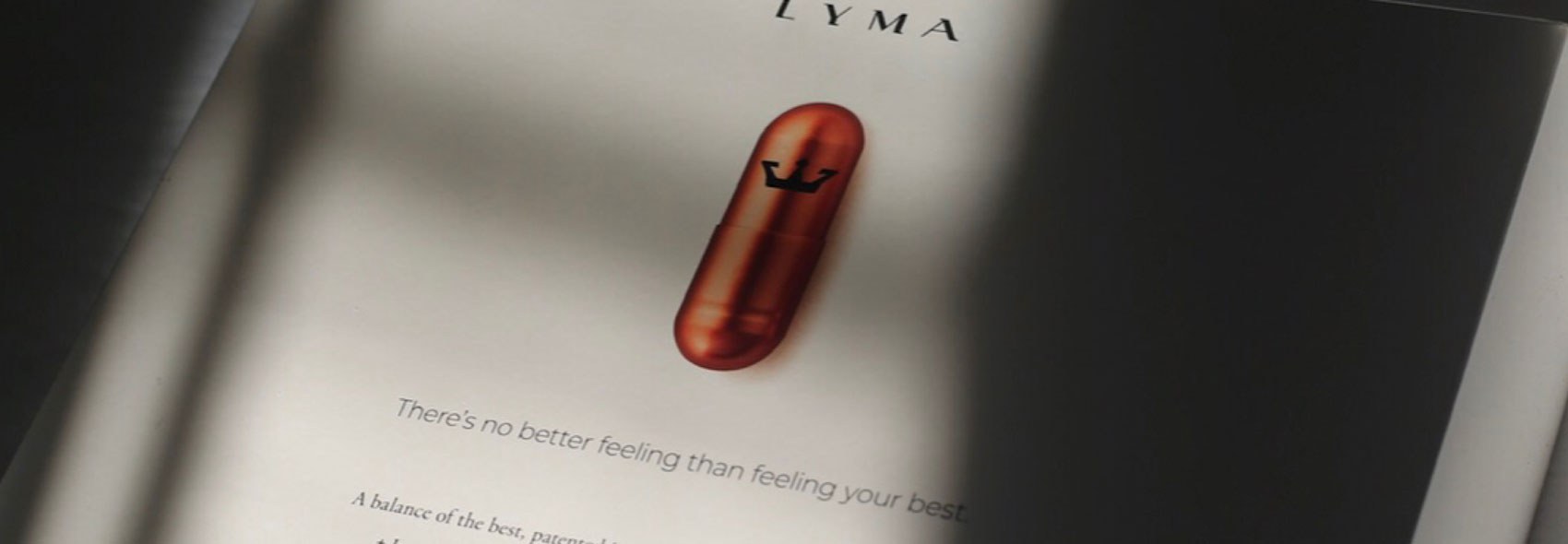 LYMA pill on a book